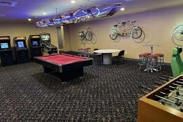 image of Diamond Beach vacation rental game room with pool table video games and game room carpet